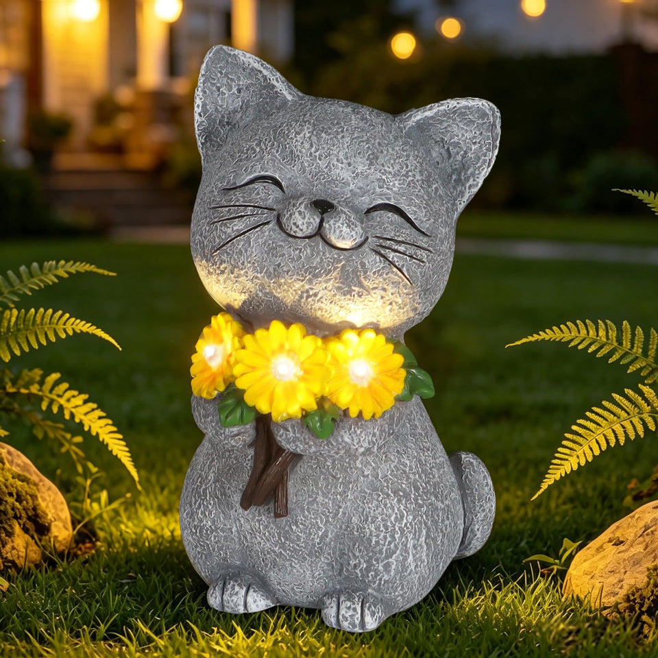 Mocosa Solar Garden Statues Cat with Daisy emits warm LED glow in the outdoor yard
