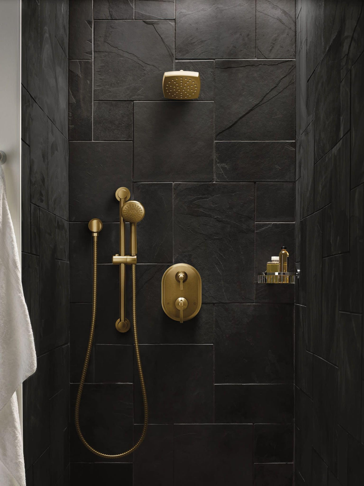 Moen brushed gold finish detail emphasizes contemporary glamour in the bathroom