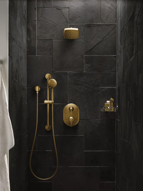Moen brushed gold finish detail emphasizes contemporary glamour in the bathroom