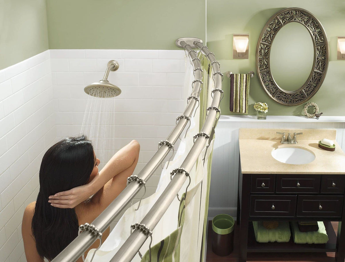 Moen closeup of brushed nickel finish on curved shower rod