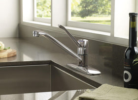 Moen Chateau chrome faucet side-arc view highlights sleek low arc design
