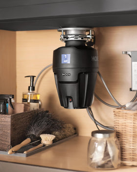 Durable steel grinding chamber inside Moen Chef EX100C.
