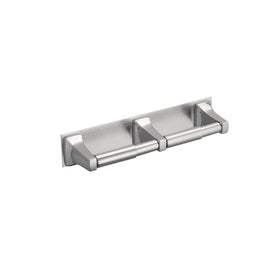 Moen Donner chrome double-roll paper holder mounted on wall with a mirror-like finish for commercial spaces.