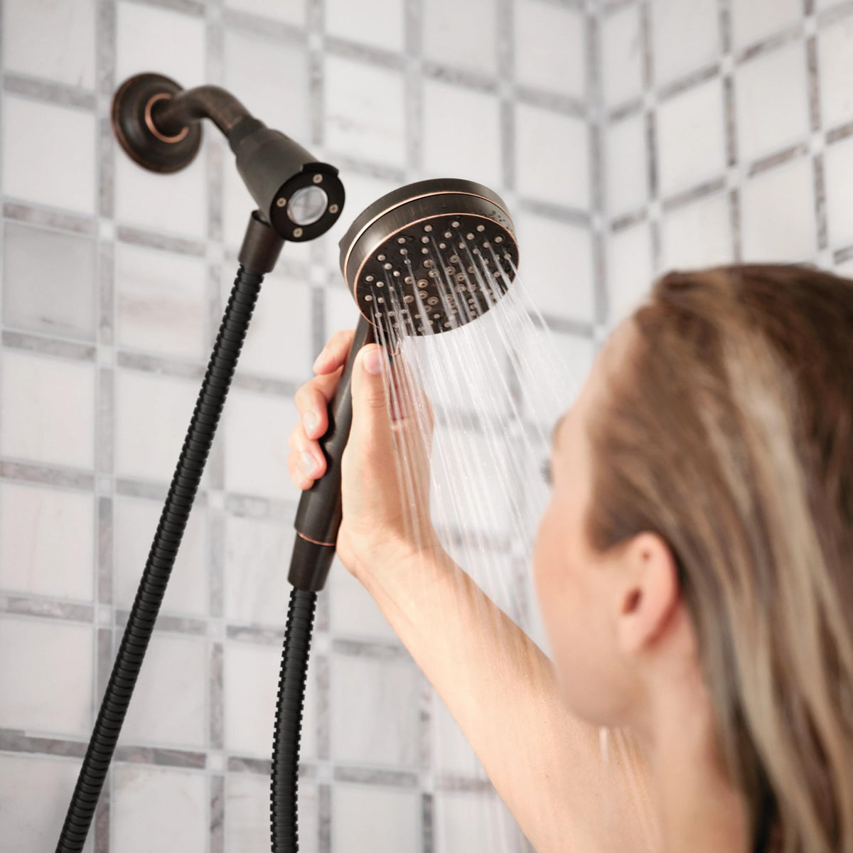 Magnetic docking system on Moen Engage Magnetix for easy storage after use