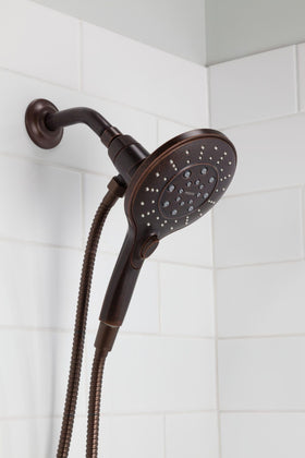 Close-up of Moen Engage Magnetix six-function controls for versatile showers.