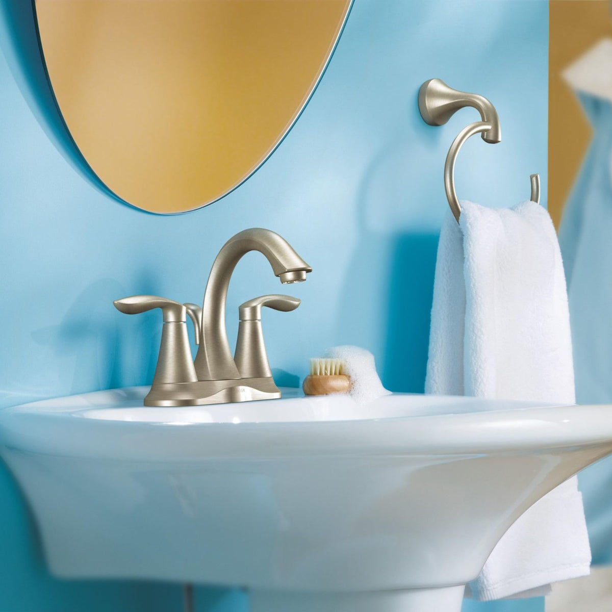 Moen Eva bathroom hardware display with towel ring and accessories.