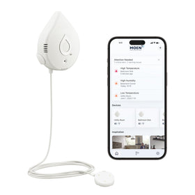 Moen Flo leak detector on tabletop with proactive moisture alerts.