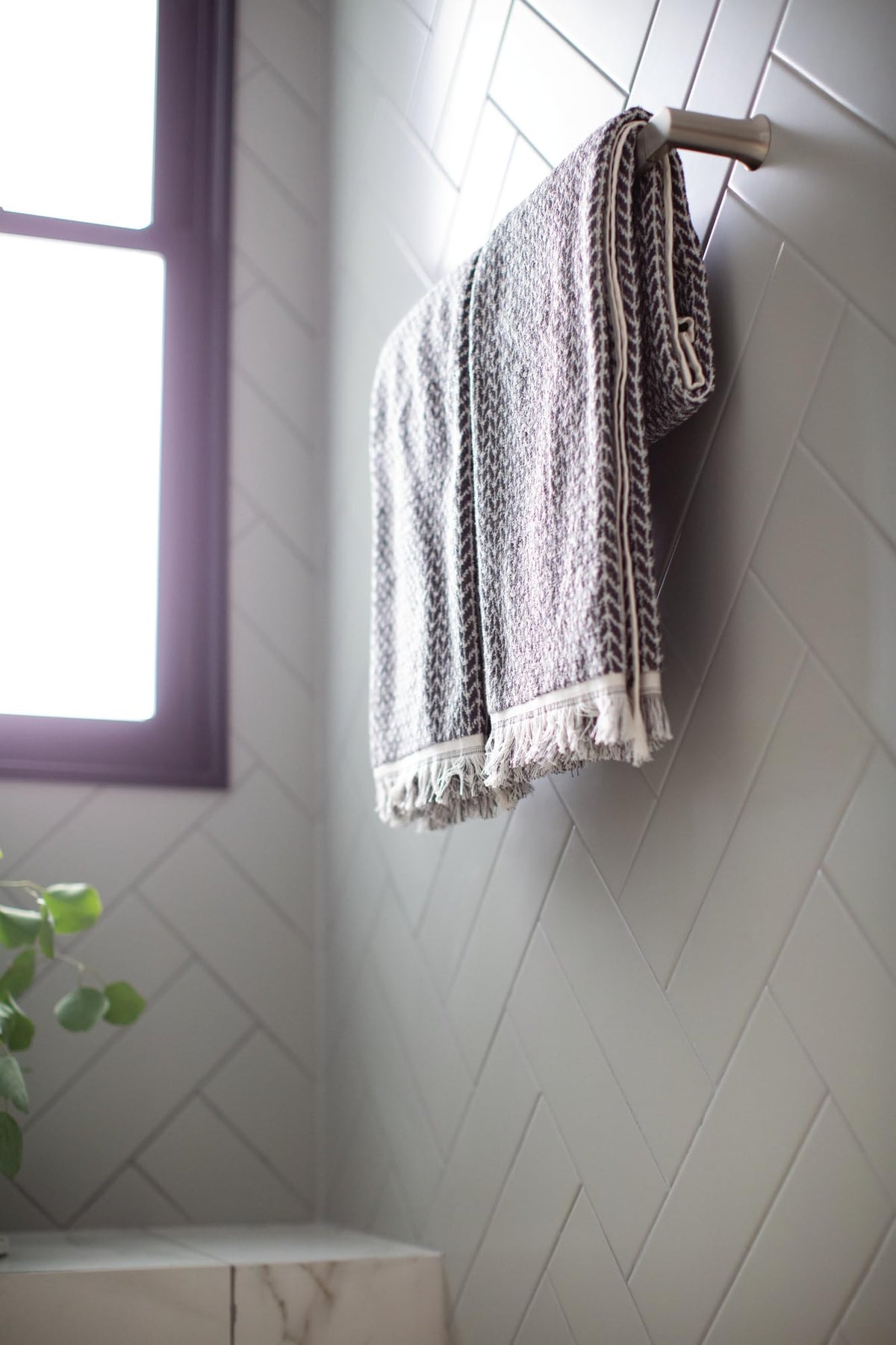Close-up of brushed nickel finish on Moen Genta LX highlights warm, reflective tones.