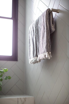 Close-up of brushed nickel finish on Moen Genta LX highlights warm, reflective tones.