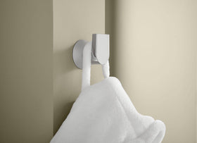 Moen Genta LX modern bathroom decor with wall-mounted robe hook.