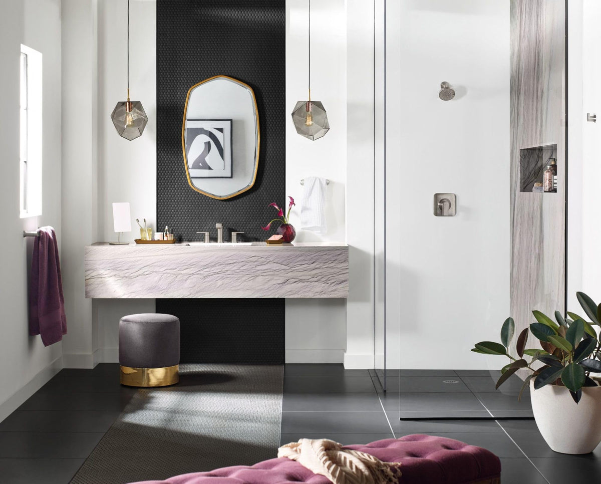 Moen Genta LX towel hook in brushed nickel for quick bathroom organization.