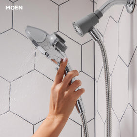 Moen Magnetic docking keeps shower head secure after detachment.