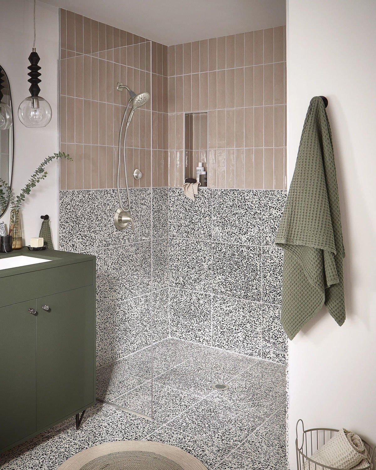Moen Magnetix dock demonstrates a secure magnetic hold for handheld shower head.