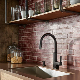 Moen dispenser side profile showcasing slim, modern silhouette and finish.