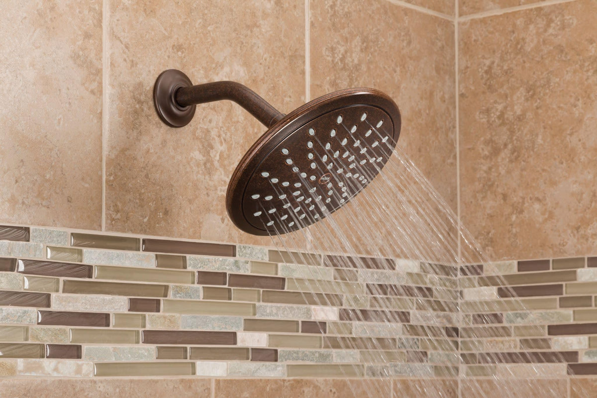 Moen oil-rubbed-bronze finish detail on the showerhead face.