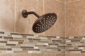 Moen rainshower nozzles close-up shows easy-clean design for longevity.