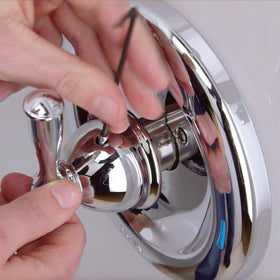 Moen Posi-Temp valve assembly inside view shows durable brass-plastic construction.