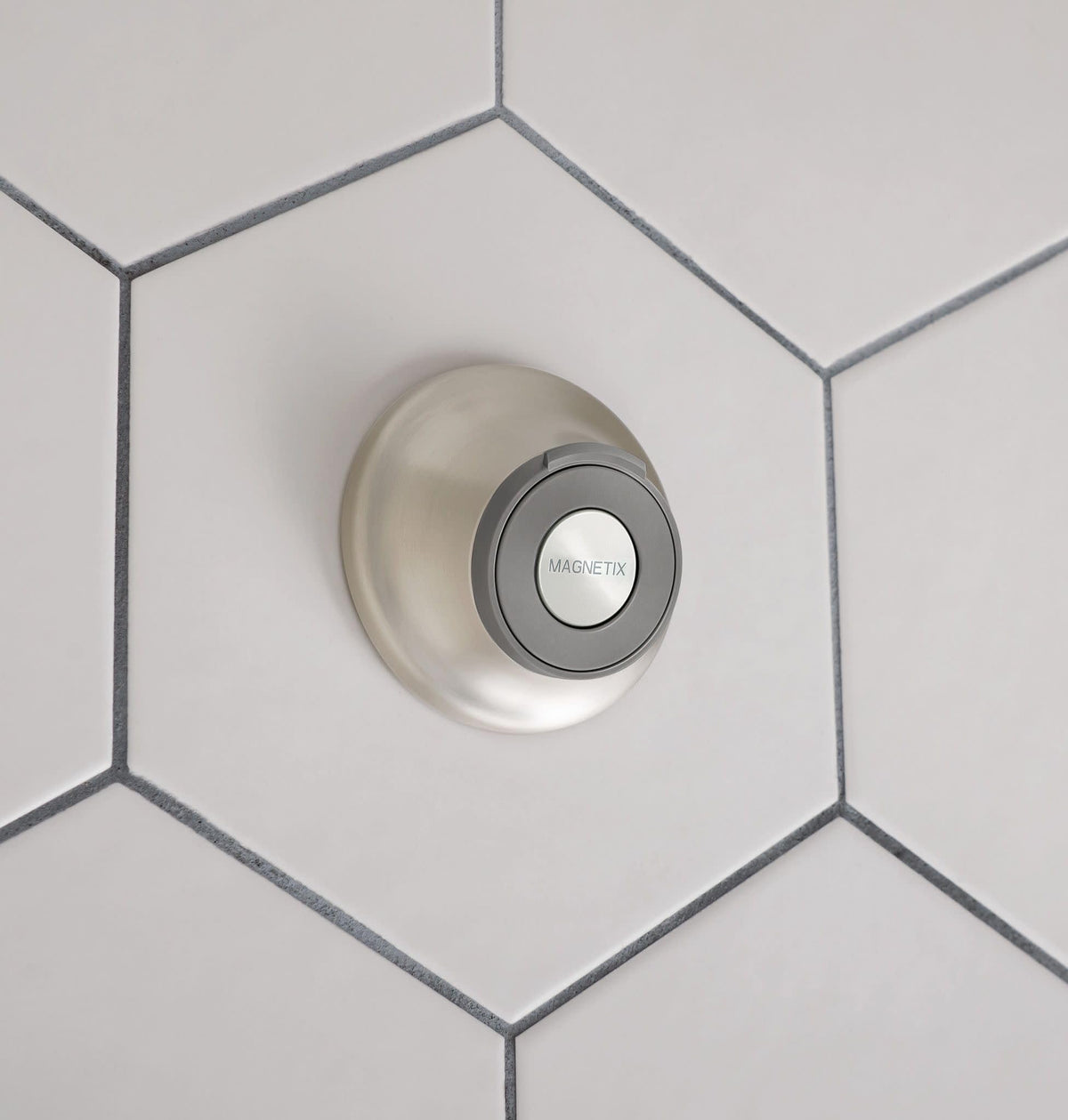Moen setup illustrates two mounting options: screws and waterproof adhesive.