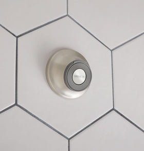 Moen setup illustrates two mounting options: screws and waterproof adhesive.
