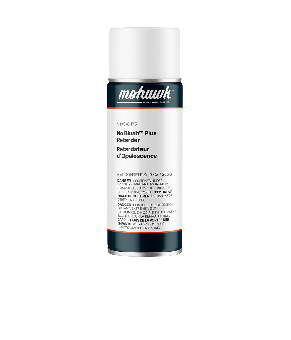 Applying Mohawk No-Blush Plus Retarder spray can to a wooden surface to reflow lacquer.
