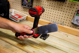 MoJack curved blade close-up showing full-length scraping action for debris removal.