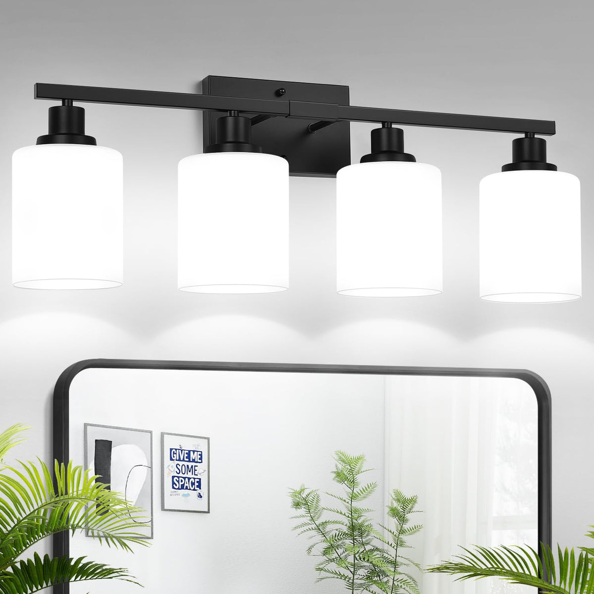 MOKATNG four-light bathroom fixture with milky shades over the mirror for diffused illumination.
