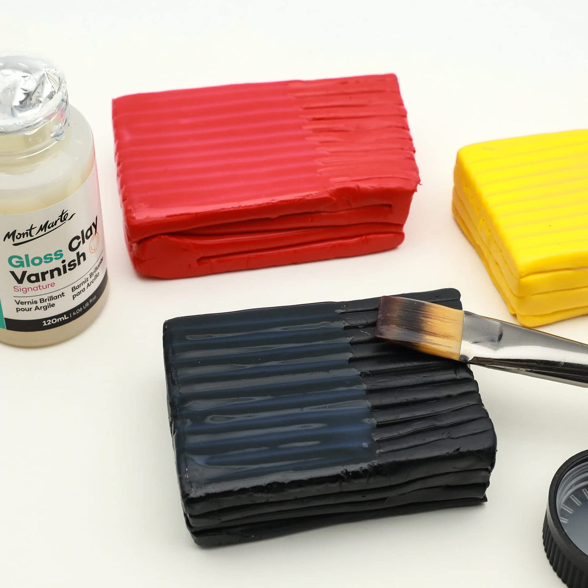 Mont Marte Transparent gloss finish drying on a clay piece to a clear sheen