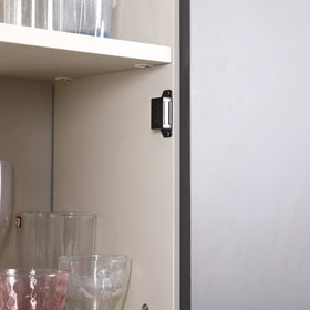 Mousike wardrobe door magnet closure showing secure clothing storage.