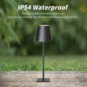 Mr. White cordless table lamp shown outdoors on a table for easy bar or patio lighting.