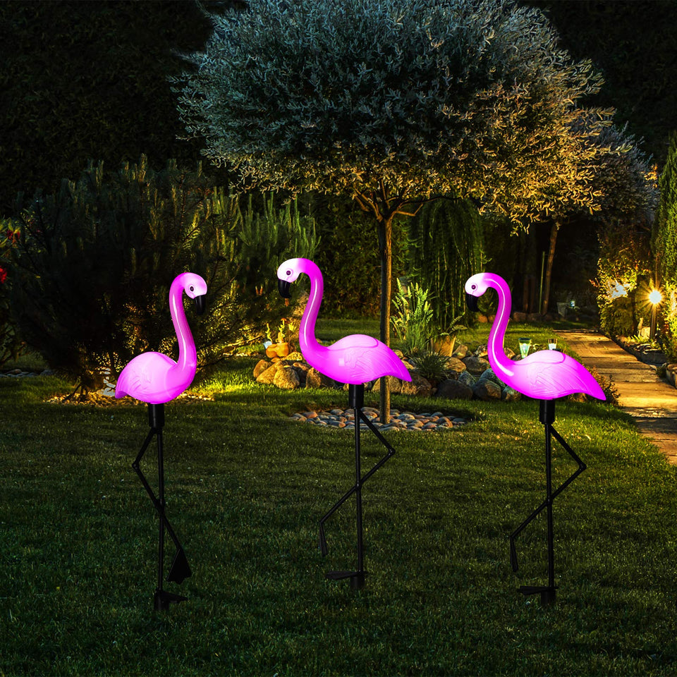 Mudder flamingo solar light stake assembly illuminates pathways with warm garden glow.
