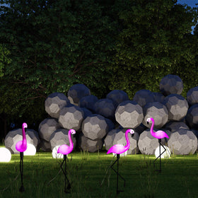 Mudder pink flamingo garden light glow enhances nighttime yard ambience.