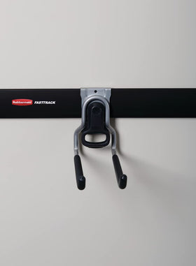 Hook holds long-handle tools neatly in place