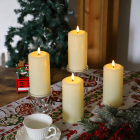 Ivory 3x6 inch pillar candle displays a realistic flicker.