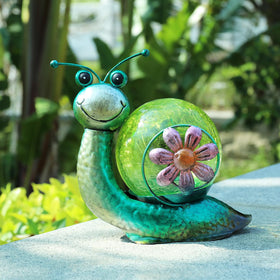 MUMTOP snail lantern creates tranquil patio sunset scene.