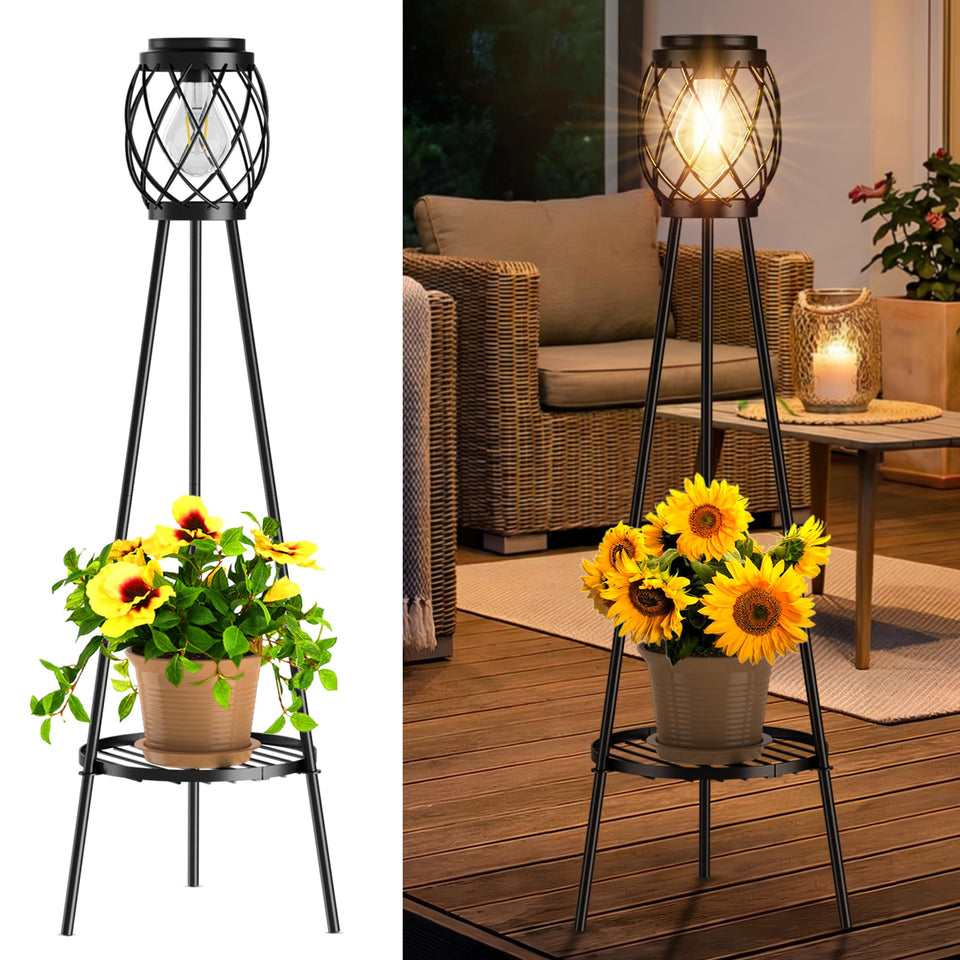 MXwcy solar floor lamp with plant stands lighting a garden path with warm ambient glow