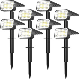 NACINIC Solar spot light front view lighting a garden path at dusk