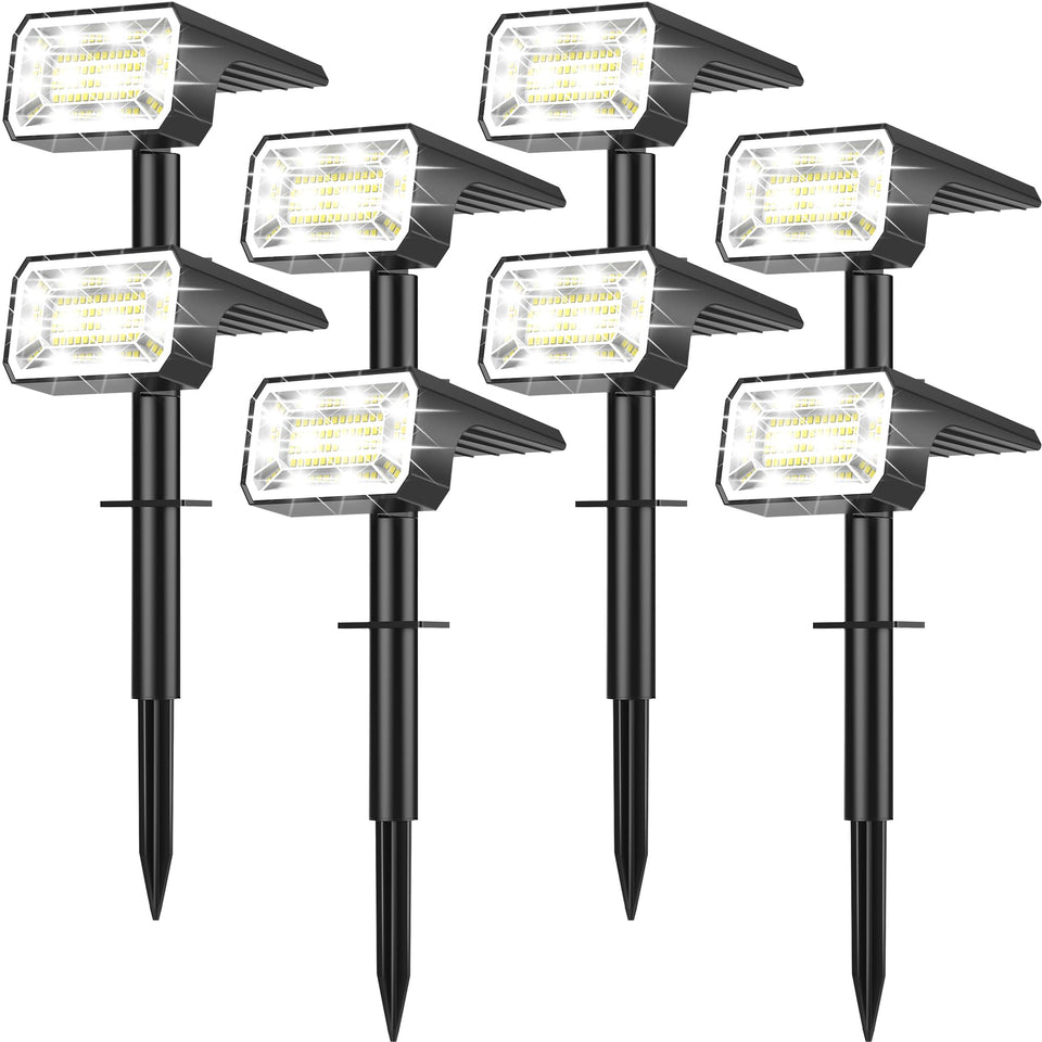 NACINIC Solar spot light front view lighting a garden path at dusk