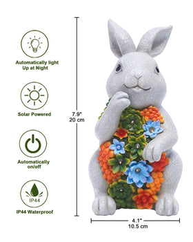 Nacome garden decor bunny with textured stone-look finish near succulents.