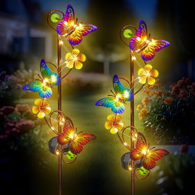 NAN ZAI NAN FANG butterfly solar stake light in garden creates warm dusk ambience.
