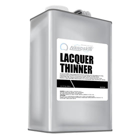 Nanoskin Lacquer Thinner bottle pour demonstrates controlled thinning for smooth coats.