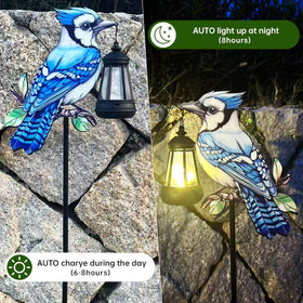Nanzhujin Redbird metal stake lantern highlighting a tactile bird design outdoors.
