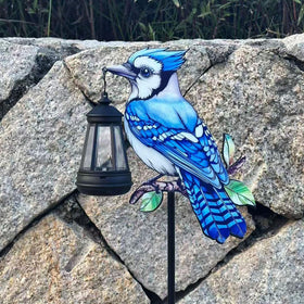 Nanzhujin Redbird solar lantern on a stake provides yard ambience after dark.