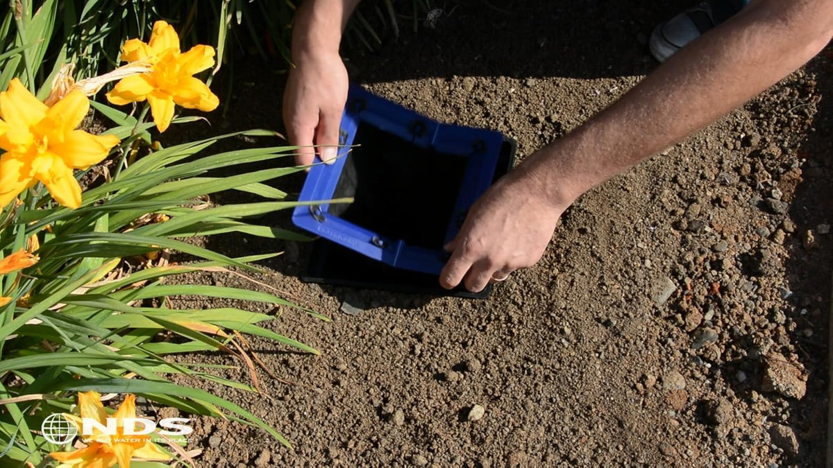 Installation step: lift grate, drop filter, then reinstall grate