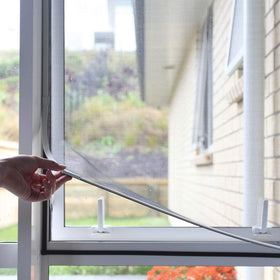 NeatiEase adjustable screen with magnet closeup showing strong seal for versatile window sizing.