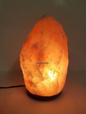 Bedroom decor accent: Needs&Gifts pink salt lamp with warm glow.