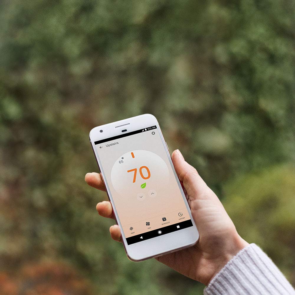 Nest Thermostat E display close-up shows minimalist design blending with walls