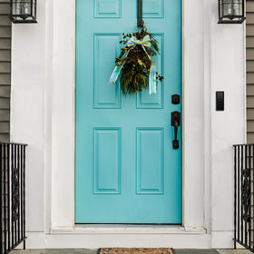 Newhouse Hardware black doorbell button in home setting for digital chimes.