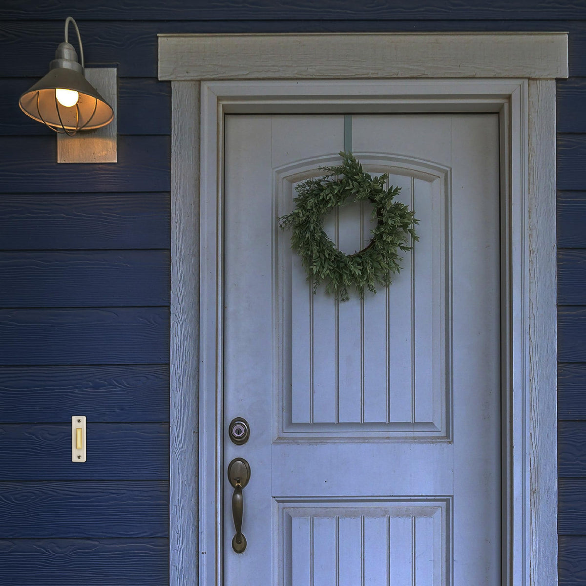 Newhouse Hardware surface-mount lighted button visible at night