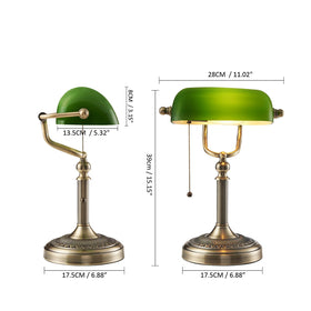 Newrays green glass bankers lamp illuminated for evening work