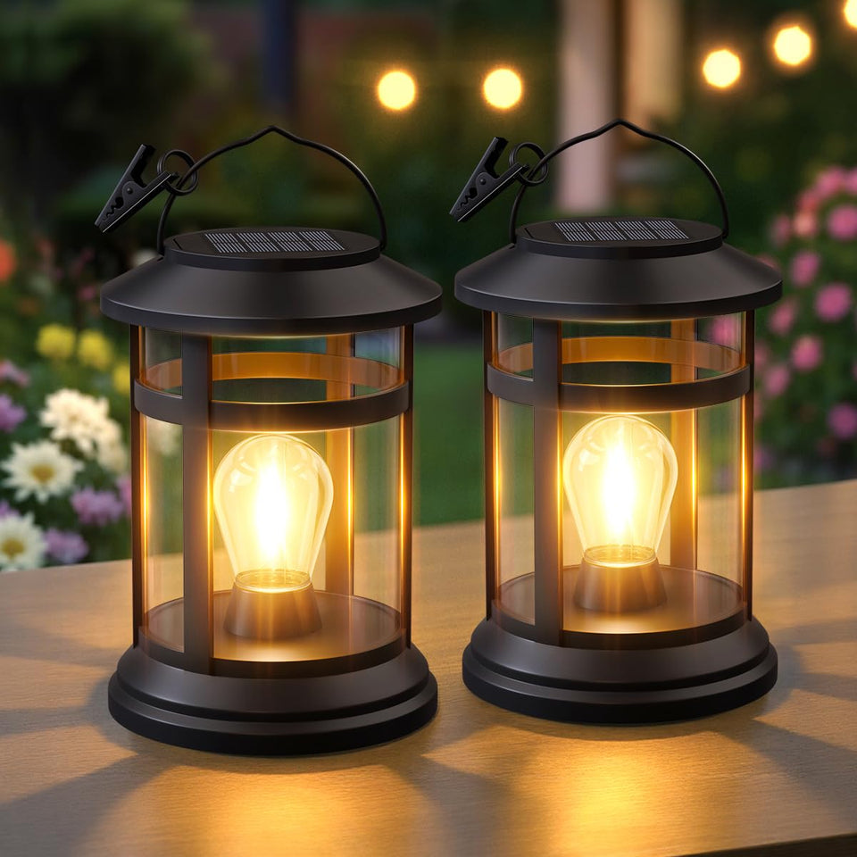 NFEVER solar lanterns in a two-pack hang outdoors for warm, year-round ambiance.